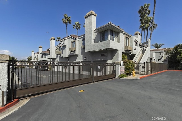 exterior space featuring fence and a residential view