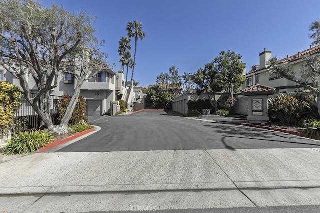 view of road with curbs and a residential view