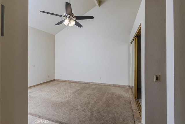 unfurnished bedroom with baseboards, ceiling fan, carpet flooring, and vaulted ceiling