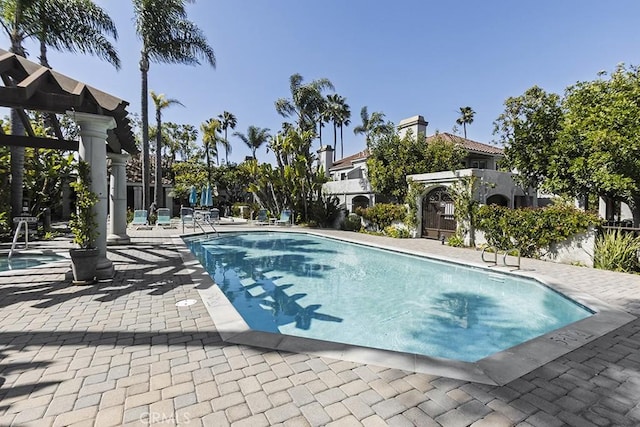 community pool with a patio