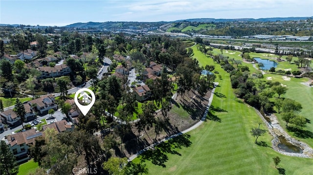 bird's eye view with a residential view, golf course view, and a water view