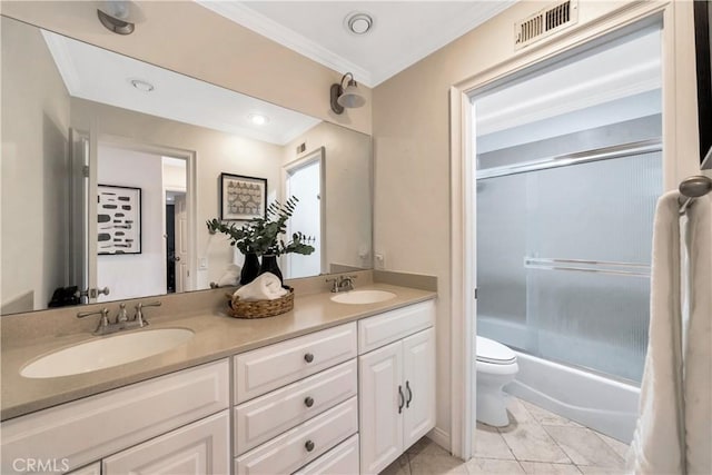 full bathroom featuring double vanity, toilet, visible vents, and a sink