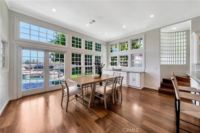 dining area featuring dark wood finished floors, recessed lighting, baseboards, and visible vents