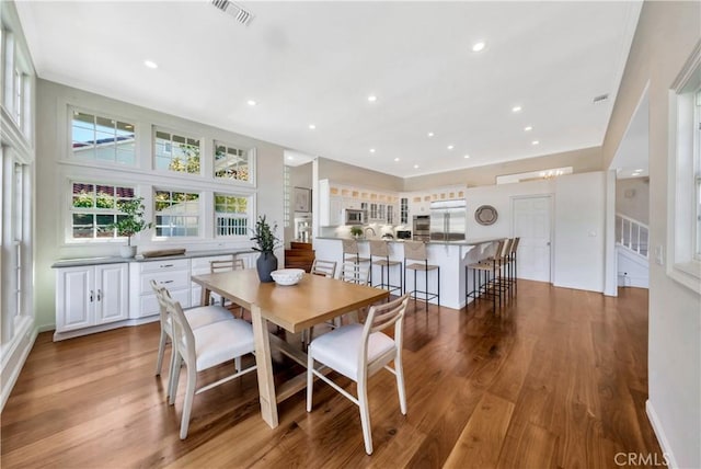 dining room featuring stairway, recessed lighting, visible vents, and light wood-type flooring