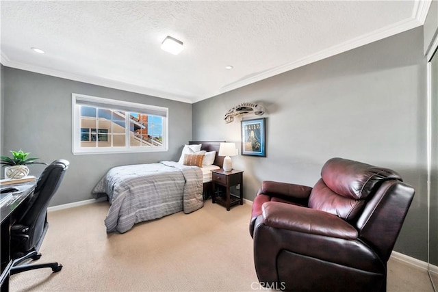 bedroom with a textured ceiling, baseboards, and carpet