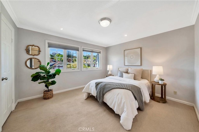 bedroom with baseboards, light carpet, and crown molding