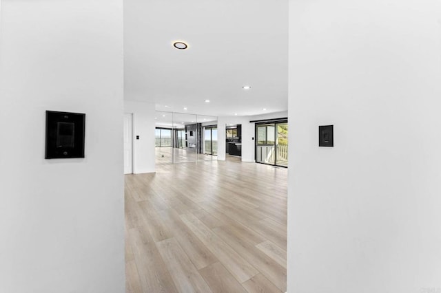 hallway with recessed lighting and light wood-type flooring