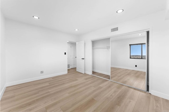 unfurnished bedroom with recessed lighting, visible vents, baseboards, and light wood-style flooring