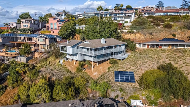 birds eye view of property with a residential view