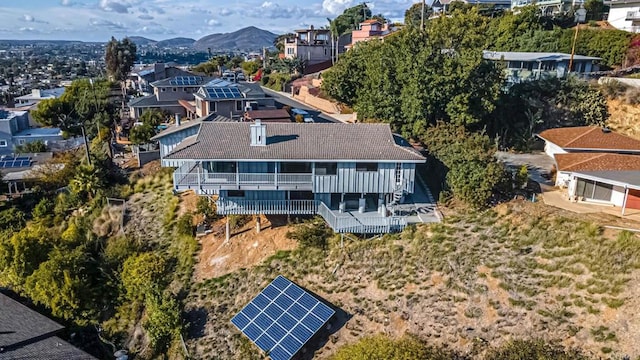 birds eye view of property featuring a mountain view and a residential view