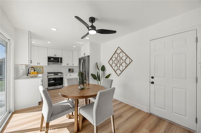 dining area with recessed lighting, light wood-style flooring, baseboards, and ceiling fan