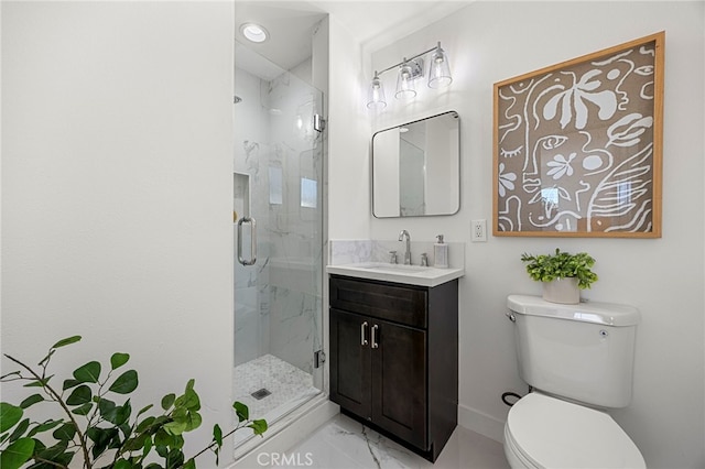 bathroom featuring vanity, toilet, marble finish floor, and a marble finish shower