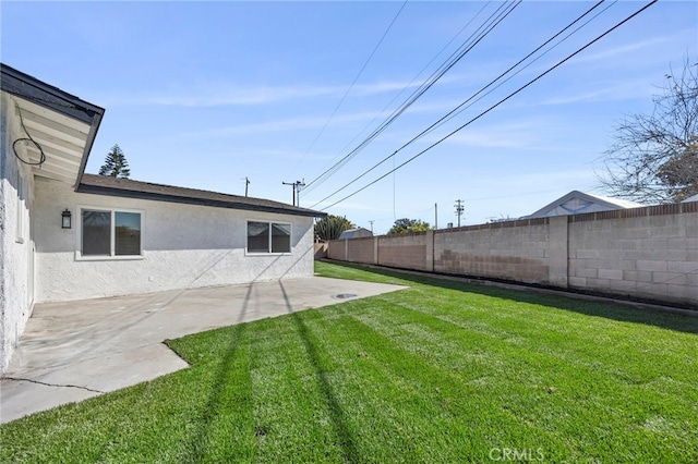 view of yard with a patio and a fenced backyard