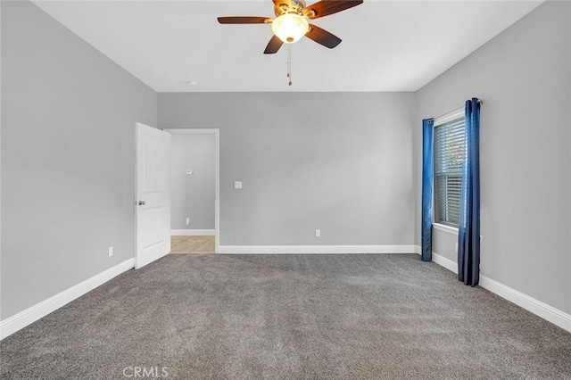 unfurnished room featuring a ceiling fan, baseboards, and carpet floors