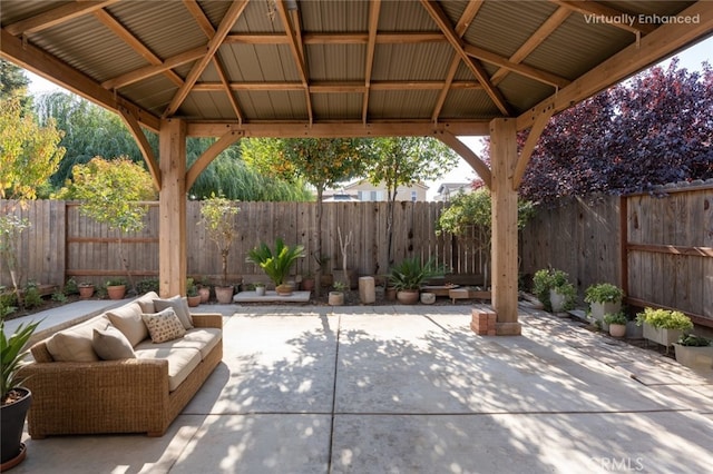 view of patio featuring outdoor lounge area, a gazebo, and a fenced backyard