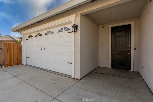 garage with fence