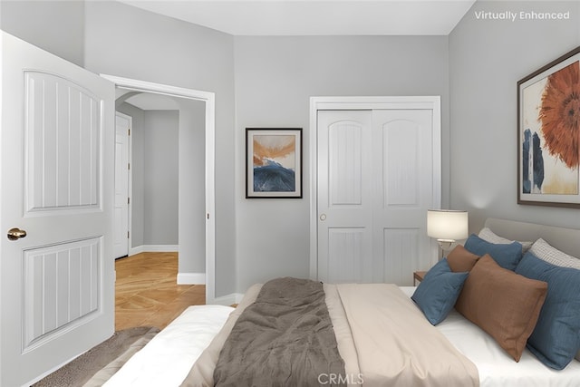 bedroom with baseboards and a closet