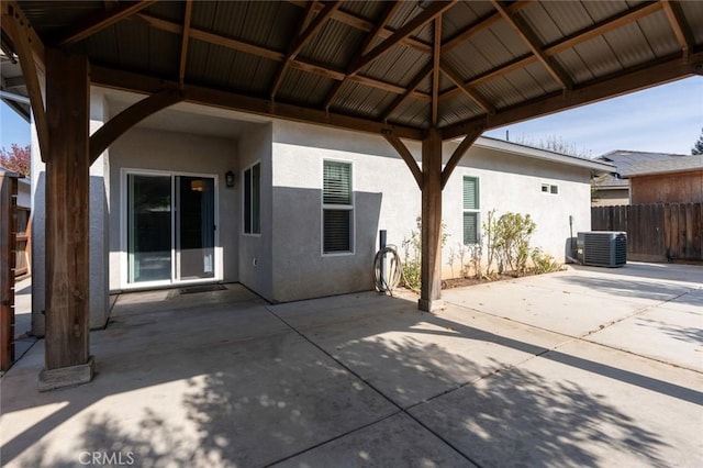 view of patio / terrace with a gazebo, central AC unit, and fence