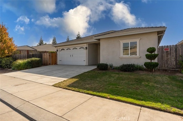 ranch-style house with stucco siding, fence, concrete driveway, a front yard, and an attached garage