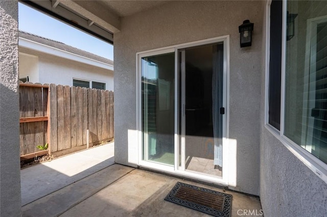 view of patio / terrace featuring fence