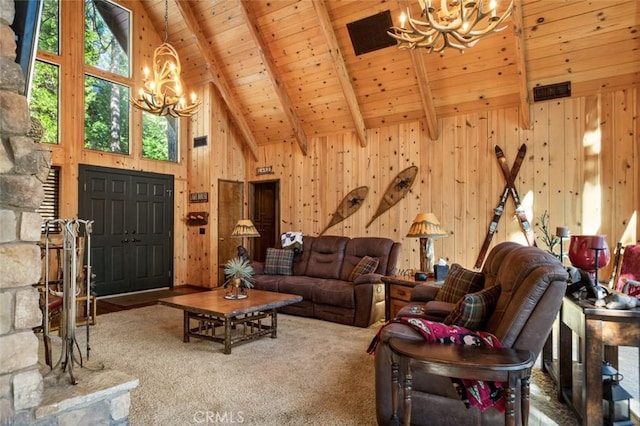 carpeted living room with high vaulted ceiling, beam ceiling, wood walls, wooden ceiling, and a chandelier