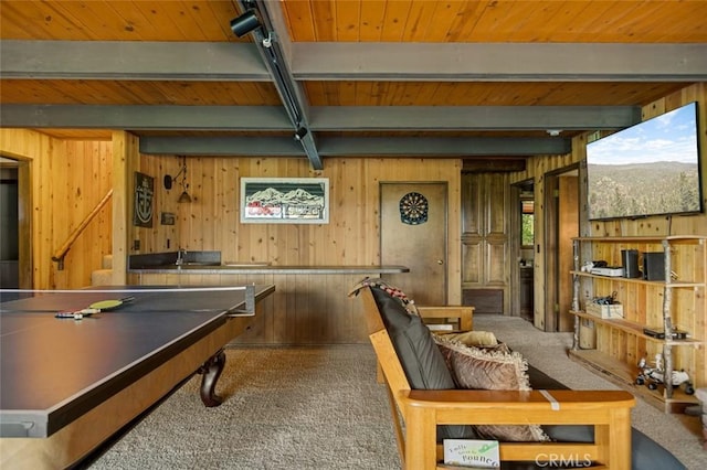 playroom featuring beamed ceiling, wooden walls, wood ceiling, and carpet flooring