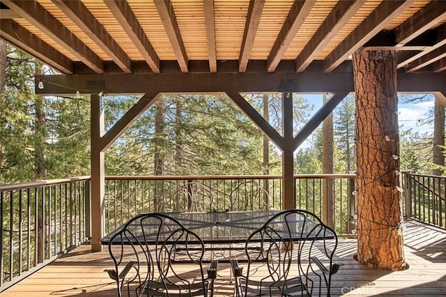 wooden deck with outdoor dining area