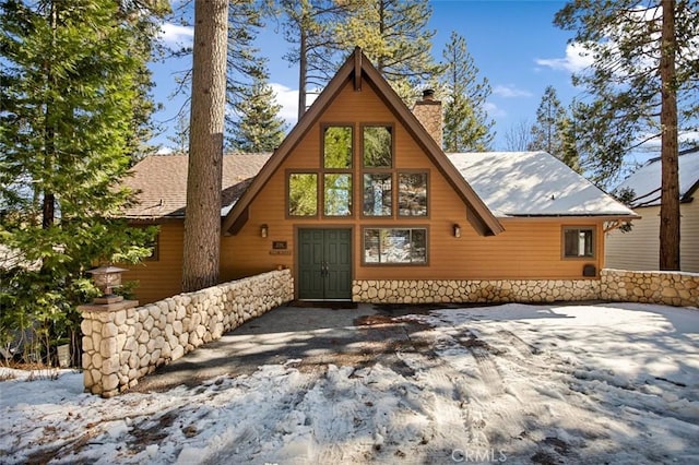 view of front of home with a chimney