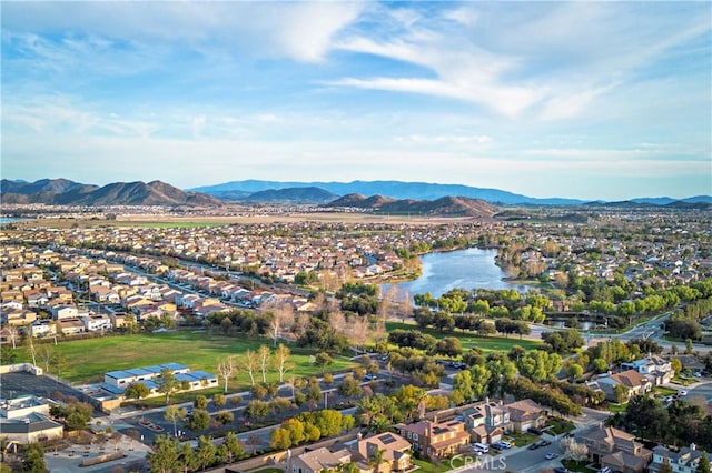 birds eye view of property with a residential view and a water and mountain view