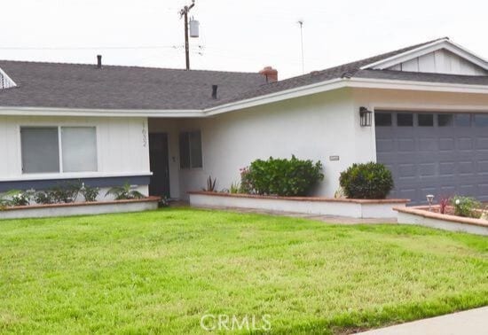 single story home featuring stucco siding, an attached garage, and a front yard