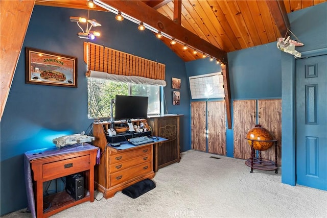 office with track lighting, wooden ceiling, vaulted ceiling with beams, and carpet floors