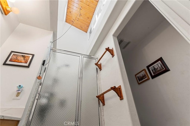 full bathroom featuring visible vents and a shower stall