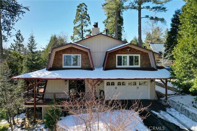 26509 Lake Forest Dr, Twin Peaks, CA 92391 - view of front of home featuring a chimney, aphalt driveway, a gambrel roof, and an attached garage