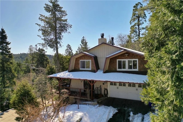 26509 Lake Forest Dr, Twin Peaks, CA 92391 - view of front facade featuring a chimney, covered porch, and an attached garage