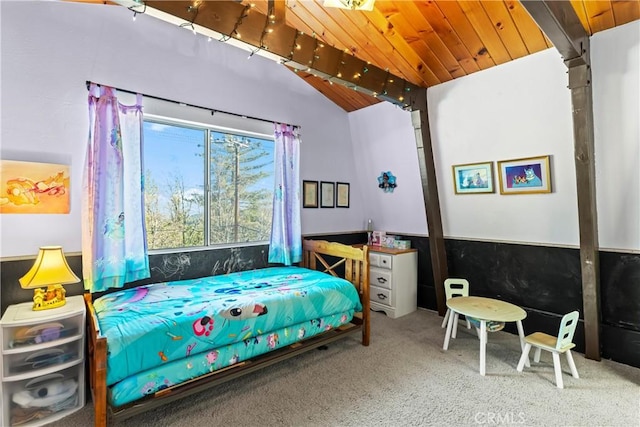 carpeted bedroom featuring wainscoting, wooden ceiling, and lofted ceiling