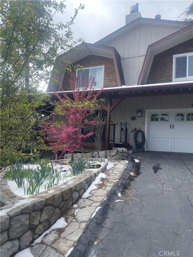 26509 Lake Forest Dr, Twin Peaks, CA 92391 - view of side of property featuring a garage and aphalt driveway