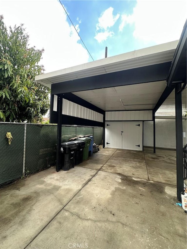 view of car parking with fence