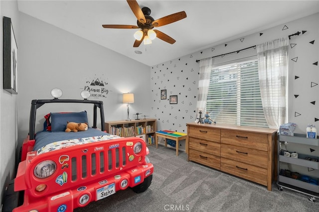 carpeted bedroom featuring ceiling fan and lofted ceiling