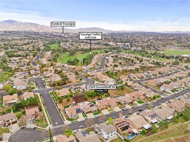 drone / aerial view featuring a mountain view and a residential view