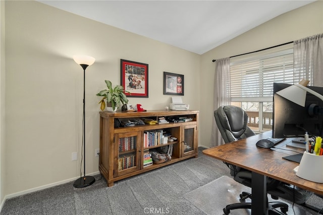 carpeted office with baseboards and lofted ceiling