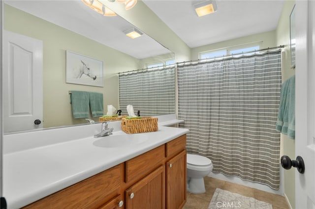 full bathroom featuring curtained shower, toilet, vanity, and tile patterned flooring