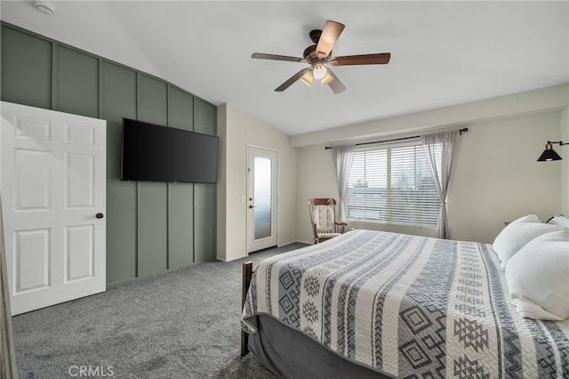 bedroom with ceiling fan, carpet flooring, and vaulted ceiling