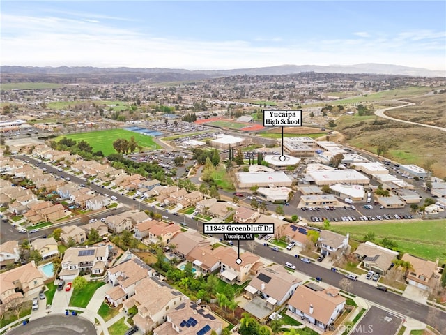 drone / aerial view with a mountain view and a residential view