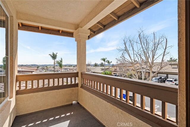 balcony with a residential view and a sunroom