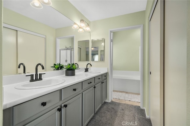 full bathroom with tile patterned flooring, double vanity, and a sink