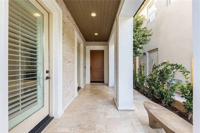 property entrance with brick siding