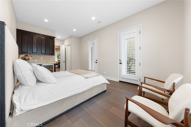 bedroom featuring dark wood finished floors, recessed lighting, wine cooler, baseboards, and access to exterior