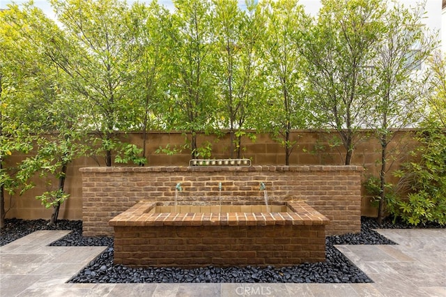 view of patio featuring fence