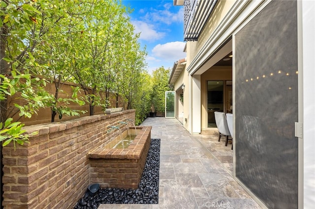 view of patio with fence