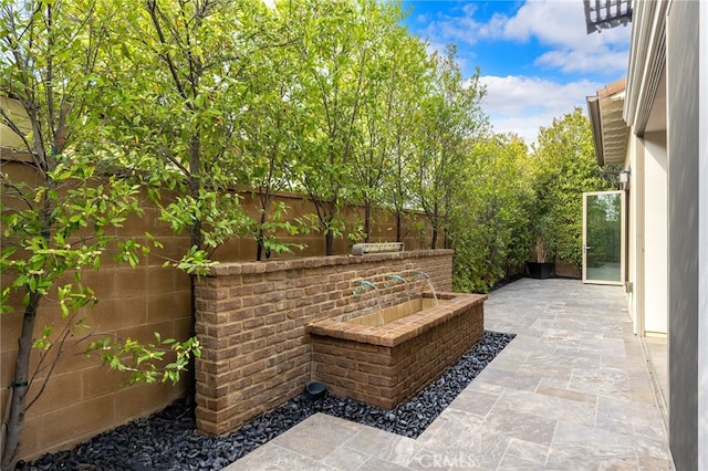 view of patio / terrace with fence